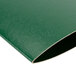 A green plastic Menu Solutions wine list cover.