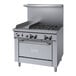 A stainless steel Garland commercial gas range with four burners and knobs.