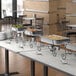 A buffet table with a Choice chafing dish set on it.
