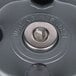 A close up of a metal object with a blurry black background.