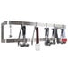 A stainless steel wall mounted double line pot rack with cooking utensils hanging from it.
