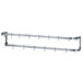A stainless steel wall mounted pot rack with hooks.