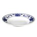 A white melamine soup plate with blue lotus flowers on it.