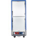A white holding and proofing cabinet with blue trim and Dutch doors.