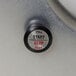 The push button on a Hobart Buffalo Chopper with a black circle.