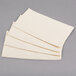 A stack of Hoffmaster ivory paper dinner napkins.