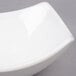 An American Metalcraft square stoneware bowl on a gray surface.