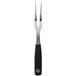 A close-up of a Mercer Culinary Genesis forged carving/pot fork with a black handle and silver metal.
