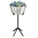 A Vollrath Double Wall Beverage Tub with ice and drinks on a stand.