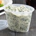 a plastic container with food in it