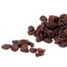 a pile of raisins on a white background