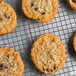 A close up of a cookie on a wire rack.