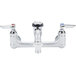 A T&amp;S polished chrome plated service sink faucet with two handles.