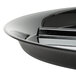 A close-up of a black WNA Comet catering tray with a silver handle.