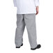 A person wearing grey Chef Revival baggy cook pants.