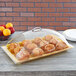 A Carlisle end cut out pastry cover on a tray of muffins on a table.