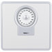 A close-up of a white Conair Thinner Dial Scale with a circular dial.