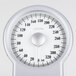 A white Conair Thinner dial scale with numbers on it.