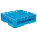 A blue plastic Carlisle glass rack with holes in it.