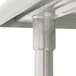 A close-up of an Advance Tabco stainless steel table leg.