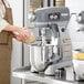 A woman's hands mixing dough in a Hobart Legacy+ commercial stand mixer.