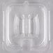 A clear plastic Carlisle StorPlus 1/6 size lid with a spoon notch and handle.