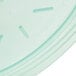 A jade green plastic lid on a clear plastic soup container.
