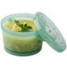 A plastic container with a jade green lid.