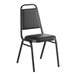 A black stackable banquet chair with a 1-inch padded seat and metal frame.