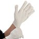 a person putting on gloves