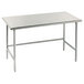 An Advance Tabco stainless steel work table with metal legs.