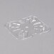 A clear plastic Carlisle 1/6 size drain tray with holes.