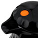 a black plastic object with a orange circle