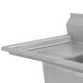 A stainless steel Advance Tabco two compartment pot sink with a left drainboard.