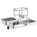 A stainless steel Choice half size chafer on a black wrought iron stand with black plastic lid handle.