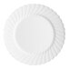 A white plate with a circular wavy design.