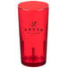 A close up of a red Cambro plastic tumbler with the word "pasta" on it.