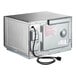 A silver rectangular Amana commercial microwave with a black cord.