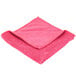 A red Unger SmartColor Microfiber cloth with a folded edge.