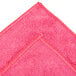 A red Unger SmartColor microfiber towel with a red edge.