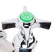 A T&S chrome lab faucet with a green button on top.