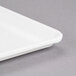 A close-up of a white Cambro dietary tray.