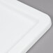 A close-up of a white rectangular Winholt WHPL-8LID-WH lid.