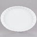 A white fluted oval serving dish.