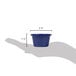 A hand holding a navy blue smooth melamine ramekin.