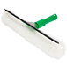 A Unger Visa Versa window squeegee with a green handle and white brush.