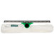 A green and white Unger Visa Versa window squeegee with a mop attachment.