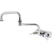 A chrome T&S wall mount faucet with double jointed swing nozzle.