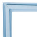 A close-up of a blue Delfield magnetic door gasket corner.