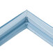 A close-up of a blue corner of a Delfield magnetic door gasket.